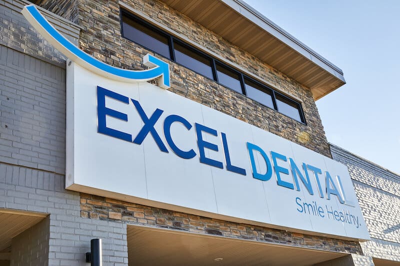 excel dental office exterior sign close up in ozark 